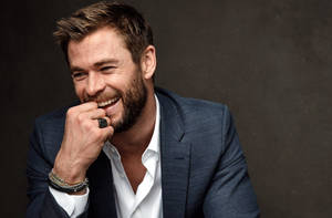 Chris Hemsworth Looking Happy Wallpaper