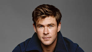 Chris Hemsworth Strikes A Pose In A Blue Jacket. Wallpaper