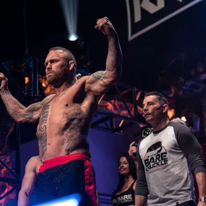 Chris Leben Demonstrating Well-built Physique And Unique Tattoos Wallpaper