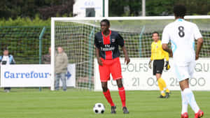 Chris Mavinga Red Kit Soccer Field Wallpaper