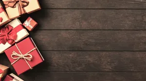 Christmas Aesthetic Gifts On Wood Wallpaper
