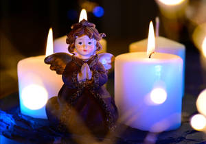 Christmas Angel And White Candles Wallpaper