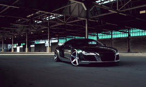 Chrome Luxury Car Parked In Spacious Warehouse Wallpaper