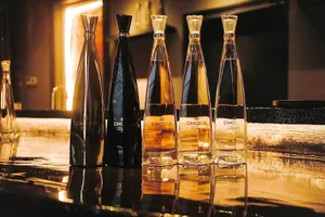 Cincoro Tequila Bottle Gold Reflection Wallpaper