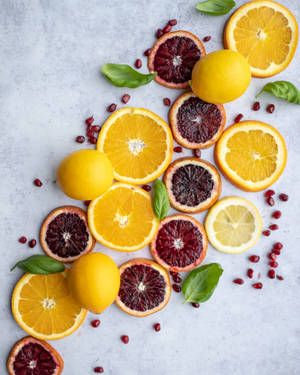 Citrus Fruit With Basil Leaves Wallpaper