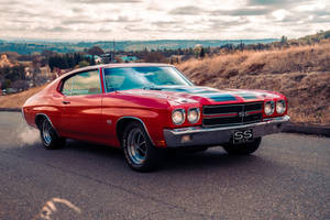 Classic Chevrolet Chevelle In Action Wallpaper