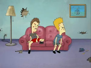 Classic Duo Beavis And Butt-head Lounging On Couch Wallpaper