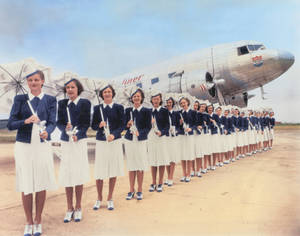 Classic Era Of Aviation With Trans World Airlines Flight Attendants Wallpaper