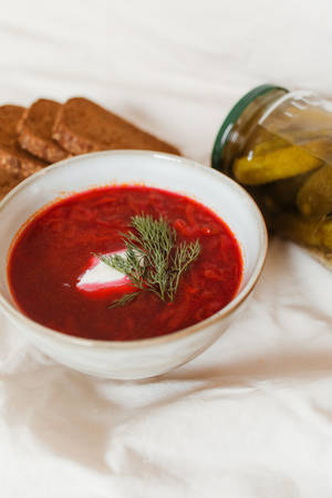 Classic Red Borscht Soup In A White Bowl Wallpaper