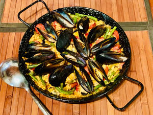 Classic Spanish Paella Dish In Natural Setting Wallpaper