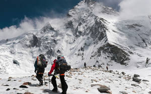 Climbing Mountain With Sharp Stones Wallpaper