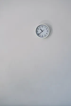 Clock On White Wall Wallpaper