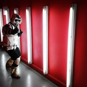 Clone Trooper In Red Armor With Helmet Wallpaper