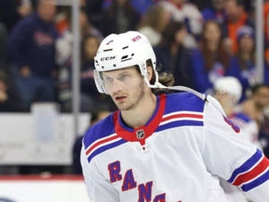 Close Up Look Of Jacob Trouba With Serious Expression During Game Wallpaper