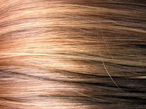 Closeup Of Shiny Brown Hair Strands Wallpaper