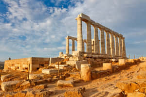 Cloudy Sky Over Sounion Pillars Wallpaper