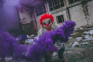 Clown Holding Purple Smoke Bomb In Ruined Building Wallpaper