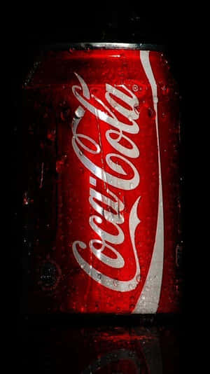 Coca Cola Can On A Black Background Wallpaper