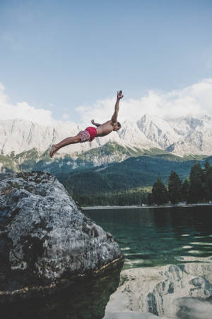 Cold Lake Jumping Wallpaper