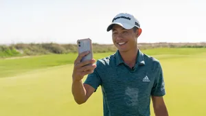 Collin Morikawa Taking A Picture Wallpaper