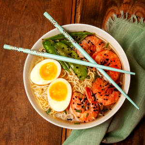 Colorful And Aromatic Traditional Bibimbap With Noodles Wallpaper