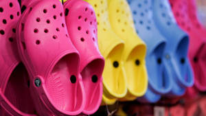 Colorful Array Of Crocs Footwear On Display Wallpaper