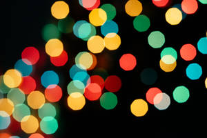 Colorful Bokeh Pattern On Black Background Wallpaper