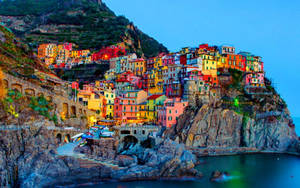 Colorful Seaside Village Of Manarola In Italy Wallpaper
