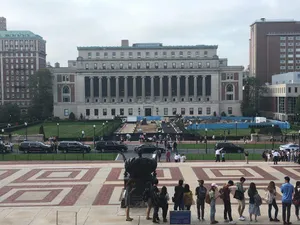 Columbia University Students Near The Sculpture Wallpaper