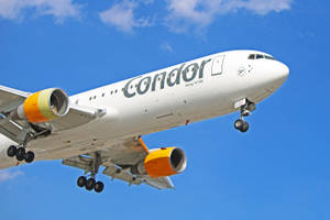 Condor Airlines Airplane In The Vast Sky Wallpaper