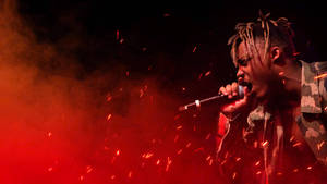 Cool Juice Wrld Singing Fiery Background Wallpaper