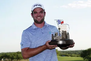 Corey Conners Holding A Trophy Wallpaper