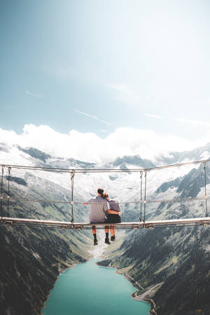 Couple Hugging In Olpererhutte Alpine Mountain Hut Austria Wallpaper