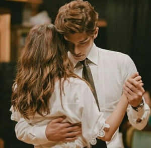 Couple Showing Sweet Affection To Each Other Wallpaper