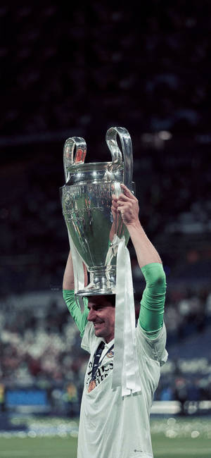 Courtois Holding Champions League Trophy Wallpaper