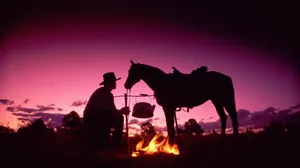 Cowboy Bonfire Dusk Wallpaper