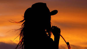 Cowgirl Holding A Rope Wallpaper