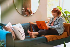 Cozy Home Office Environment With A Pink Laptop Wallpaper