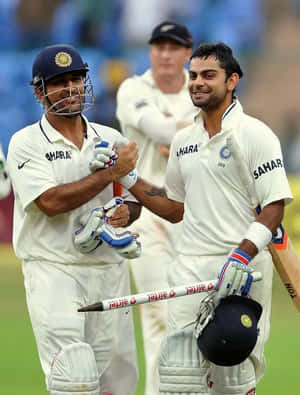 Cricketing_ Moments_ Virat_ Kohli_ Celebration_ With_ Teammate Wallpaper