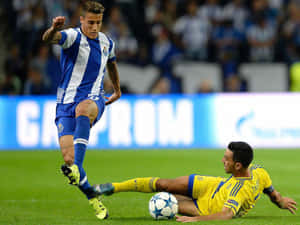 Cristian Tello Dodging Tackle Football Match Wallpaper