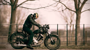 Cruising Down The Pavement On A Harley Davidson V-rod Wallpaper