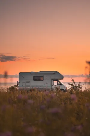 Cruising Into The Sunset In A Vans Wallpaper