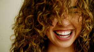 Curly Hair Smile Wallpaper