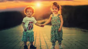 Cute Baby Couple Holding Hands Sunset Wallpaper