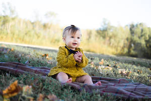 Cute Baby In Yellow Dress Wallpaper