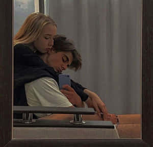 Cute Boyfriend Smiling And Embracing His Girlfriend Wallpaper