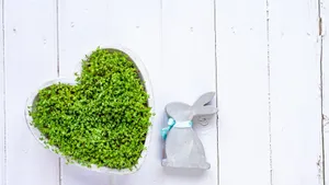 Cute Easter Bunny Peeking Out From Behind A Hay Stack Wallpaper