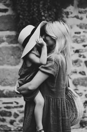 Cute Kid With Mother Wallpaper