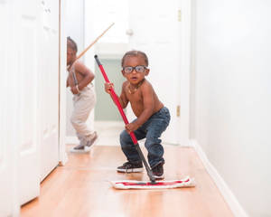 Cute Mopping Toddlers House Cleaning Wallpaper