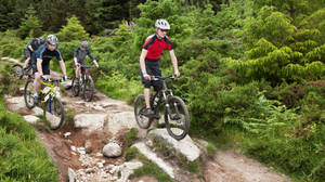 Cyclists Mountain Biking Rocky Mountain Terrain Wallpaper